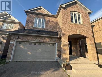Milton (Cl Clarke) apartment for rent - A house with a brick facade and a white garage door.