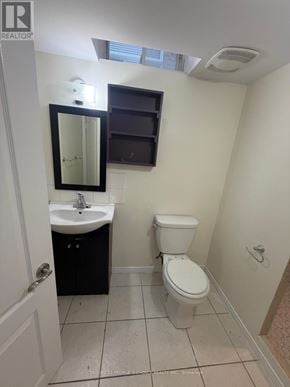 Milton (Cl Clarke) apartment for rent - A small bathroom with a toilet, sink, and mirror.