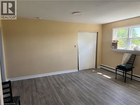 Dunnville apartment for rent - A room with a chair and a window.