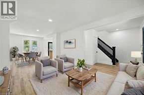 Hamilton apartment for rent - A living room with a wooden coffee table and grey couches.