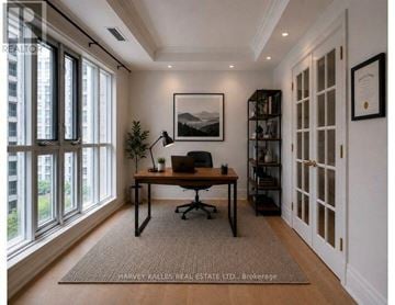 Toronto (Yonge-St. Clair) condo for rent - A room with a desk, chair, and a framed picture on the wall.