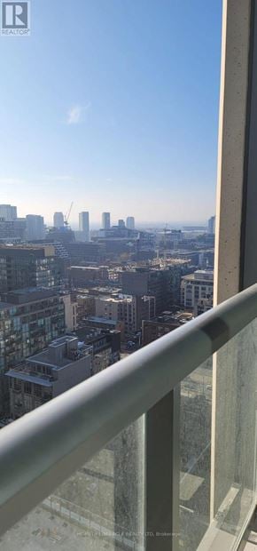 Toronto (Waterfront Communities) condo for rent - A cityscape viewed from a high-rise building.
