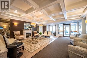 Waterloo condo for rent - A spacious living room with a fireplace and a large rug.