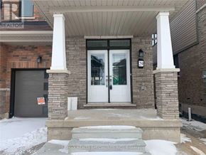 Brantford apartment for rent - A house with a white door and a sign that says RE/MAX Realty Specialists Inc. Brokerage.