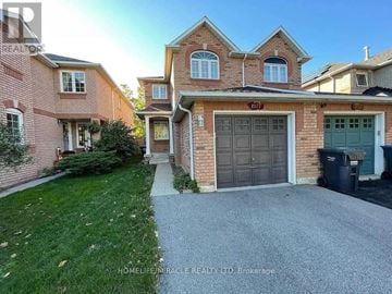 Mississauga (Meadowvale Village) apartment for rent - A house with a driveway in front of it.