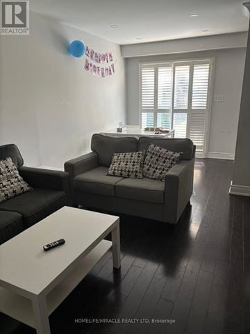 Mississauga (Meadowvale Village) apartment for rent - A living room with a grey couch and a white coffee table.