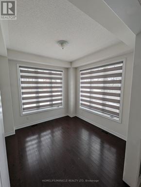 Collingwood apartment for rent - A room with wooden floors and white walls.