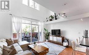 Toronto (Long Branch) townhouse for rent - A living room with a couch, a television, and a dining table.