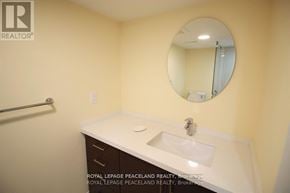 Oakville (Ga Glen Abbey) apartment for rent - A bathroom with a sink and mirror.