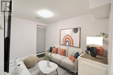 Hamilton (Landsdale) apartment for rent - A living room with a grey couch, a white coffee table, and a painting on the wall.