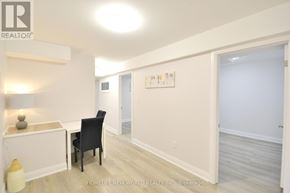 Hamilton (Landsdale) apartment for rent - A room with a chair and a table with a lamp.