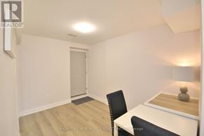 Hamilton (Landsdale) apartment for rent - A room with a chair and a desk with a lamp on it.