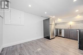 Hamilton (Beasley) multi-family for rent - A kitchen area with a refrigerator, cabinets, and a countertop.