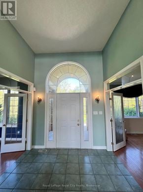 Guelph (Pineridge/Westminster Woods) apartment for rent - A white door with a light above it in a room.