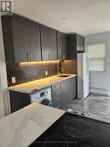 Peterborough (Ashburnham Ward 4) multi-family for rent - A kitchen with black cabinets and a marble countertop is under construction.
