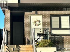 Kitchener townhouse for rent - A house with a door and a window is shown.