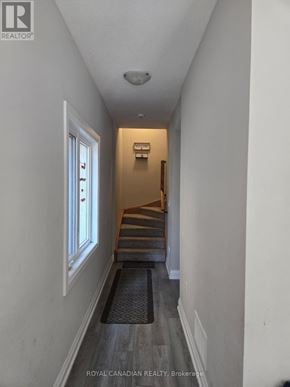 Hamilton (Winona Park) townhouse for rent - A hallway with a staircase leading to the second floor.