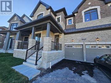 Pickering apartment for rent - A modern kitchen with a stove and cabinets.