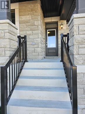 Pickering apartment for rent - A kitchen with white cabinets and a granite countertop.