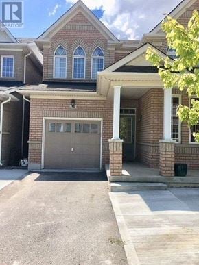 Markham (Box Grove) apartment for rent - A house with a garage and a driveway in front.