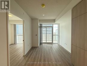 Vaughan (Vaughan Corporate Centre) condo for rent - A spacious room with wood flooring and a large window.