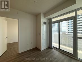 Vaughan (Vaughan Corporate Centre) condo for rent - A room with a sliding glass door leading to a balcony.