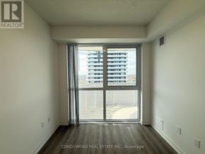 Vaughan (Vaughan Corporate Centre) condo for rent - A room with a sliding glass door leading to a balcony.