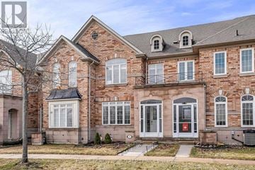 Markham (Cornell) townhouse for rent - A large red brick house with a black door and windows.