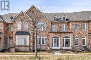 Markham (Cornell) townhouse for rent - A red brick house with a white door and windows.