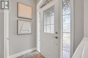 Markham (Cornell) townhouse for rent - A hallway with a white door and two pictures on the wall.