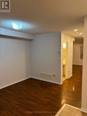 Whitby (Taunton North) townhouse for rent - A room with wooden flooring and white walls.