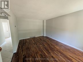 London South (South X) apartment for rent - A room with wooden flooring and white walls.