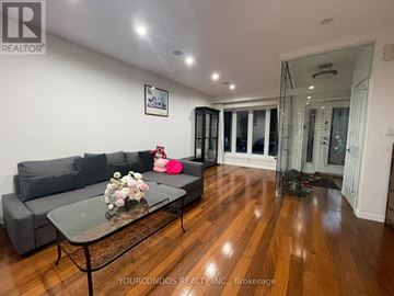 Toronto (University) apartment for rent - A living room with a glass table and grey couch.