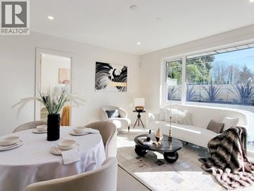 West Vancouver apartment for rent - A well-lit, modern living room with a dining table set for two.