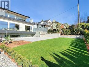 West Vancouver apartment for rent - A well-maintained lawn in front of a modern house.