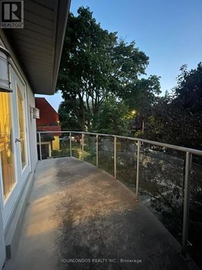 Toronto (University) apartment for rent - A balcony with a metal railing and a concrete floor.