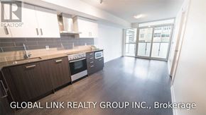 Toronto (Mount Pleasant West) condo for rent - A kitchen with wooden cabinets and a tile backsplash is shown.