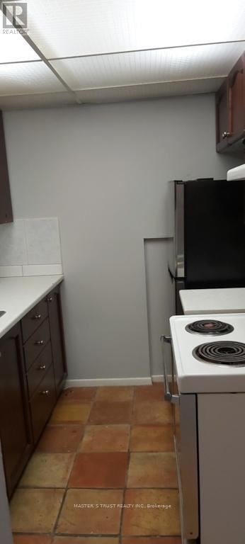 Barrie (Codrington) apartment for rent - A kitchen with a stove and tile floor.