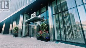 Toronto (Waterfront Communities) condo for rent - The entrance to a building with the number 128 on it.