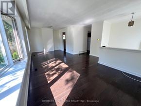 Aurora (Aurora Heights) apartment for rent - A sunlit room with wooden floors and white walls.