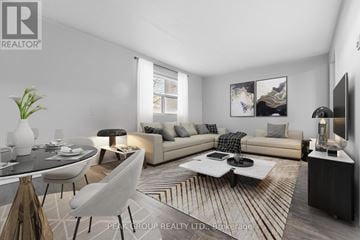 Welland (Lincoln/Crowland) multi-family for rent - A modern living room with a glass table and a white sofa.