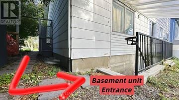Ottawa apartment for rent - A basement unit entrance is shown with a red arrow pointing to it.