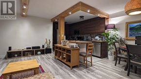 Toronto (Don Valley Village) condo for rent - A living room with a wooden coffee table and a large window.