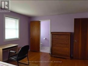 Toronto (Tam O'shanter-Sullivan) apartment for rent - A room with a desk, chair, and wardrobe.