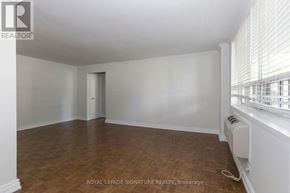 Toronto (Church-Yonge Corridor) condo for rent - A room with wooden flooring and white walls, with a window on the right side.