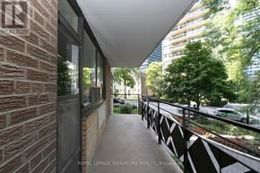 Toronto (Church-Yonge Corridor) condo for rent - A balcony with a brick wall and a metal railing.