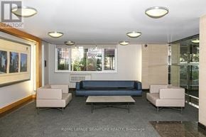 Toronto (Church-Yonge Corridor) condo for rent - A well-lit waiting room with a couch, armchairs, and a coffee table.