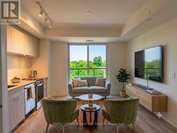 Toronto (High Park North) condo for rent - A well-lit, modern kitchen and living room with a view of the outdoors.