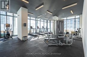 Toronto (Banbury-Don Mills) condo for rent - A gym with a row of treadmills and a row of stationary bikes.