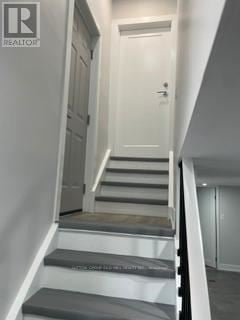 Toronto (New Toronto) apartment for rent - A white door is at the end of a hallway.